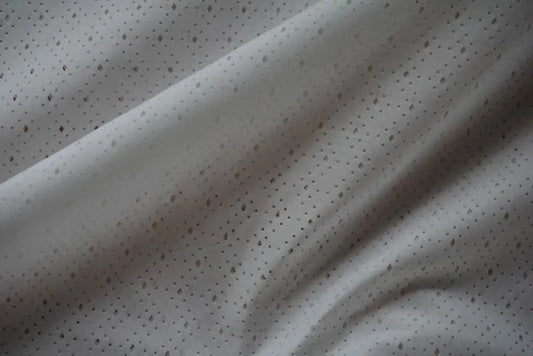 White fabric with geometric cut out