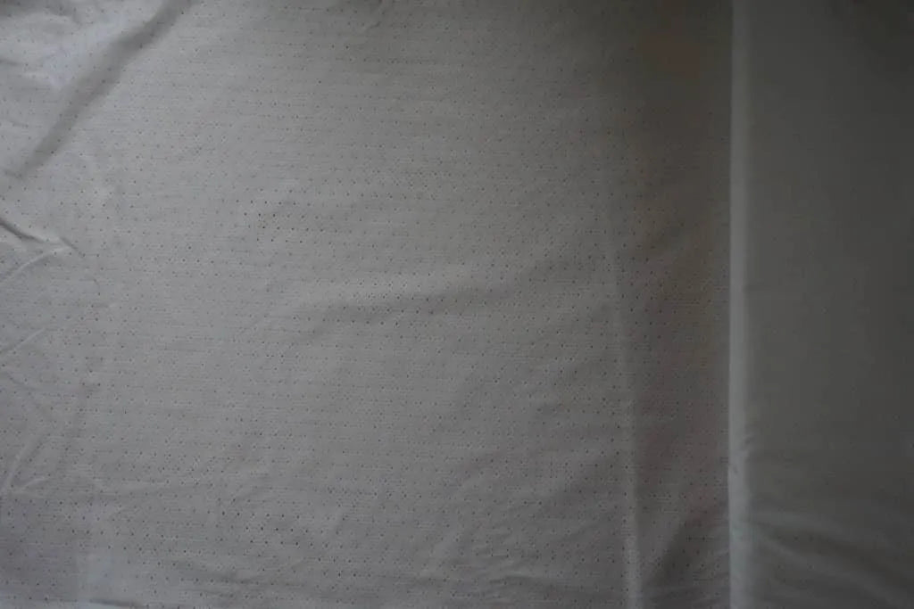 White fabric with geometric cut out