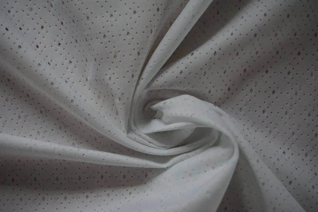 White fabric with geometric cut out